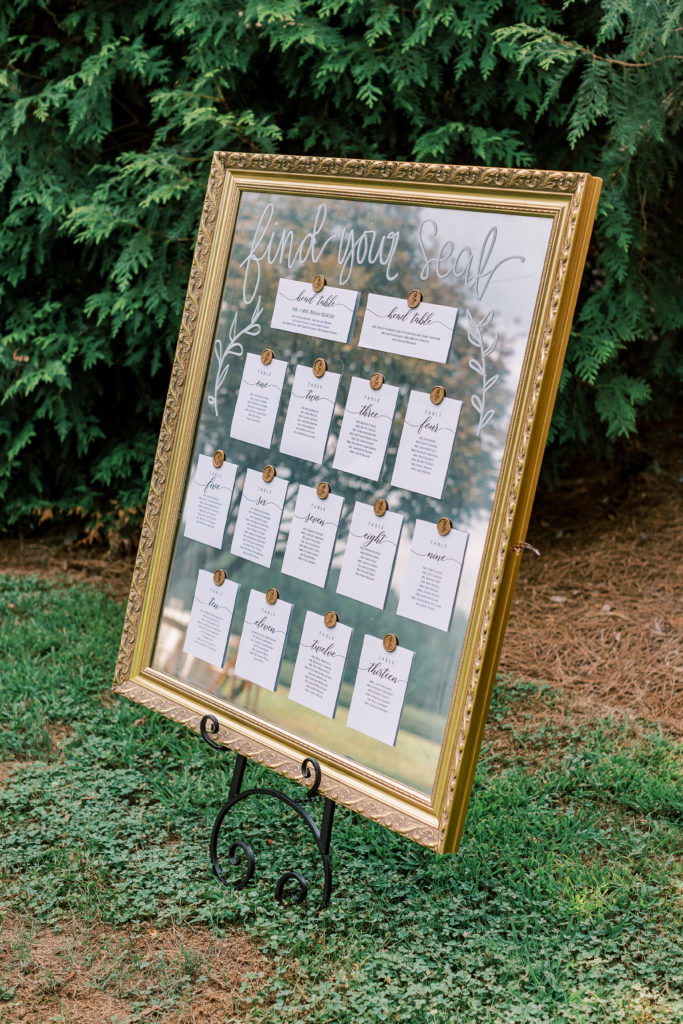 wedding seating chart on vintage mirror