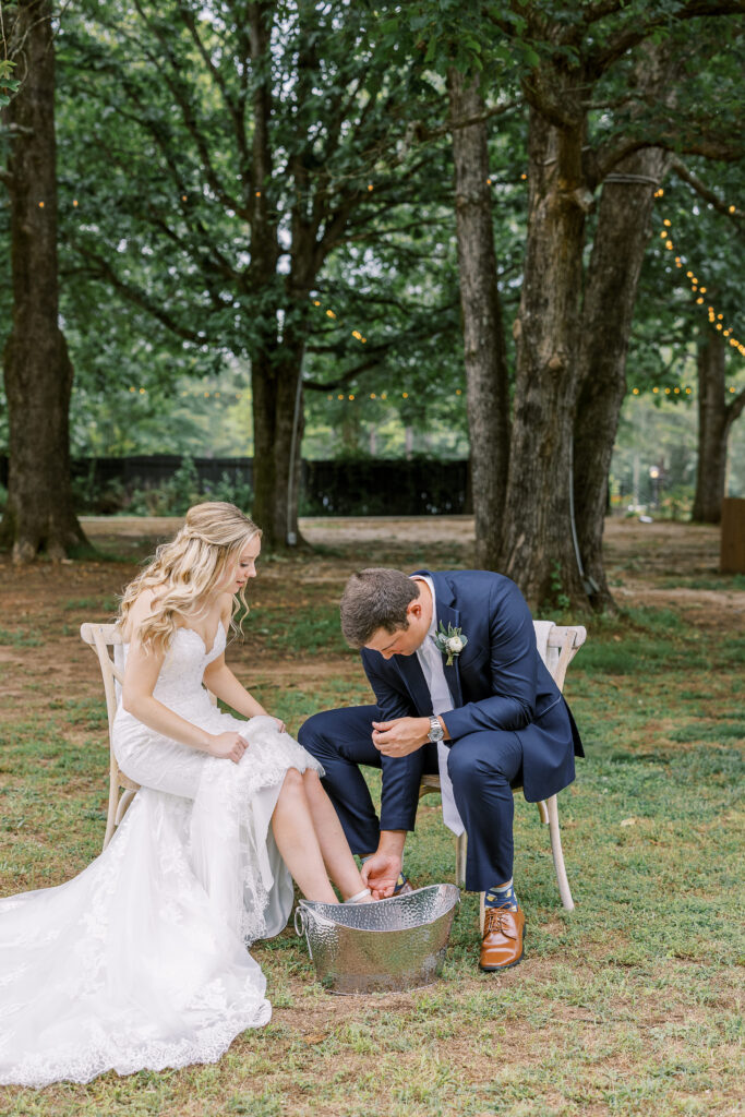 bride and groom washing each other's feet
