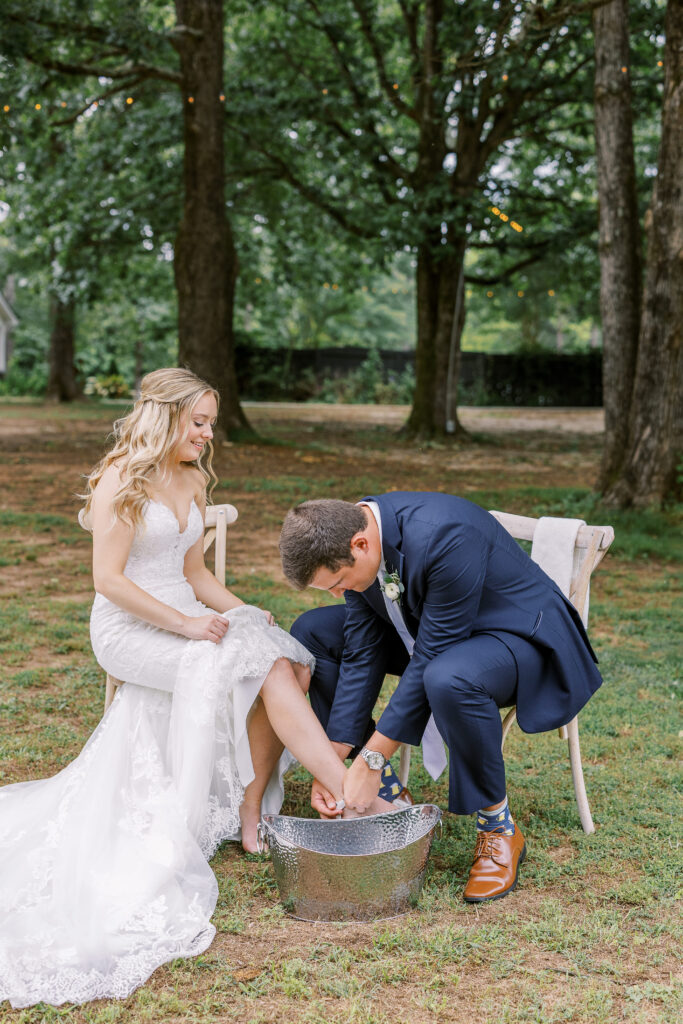 bride and groom washing each other's feet