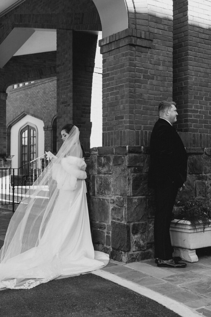 bride reading vows around the corner from her groom