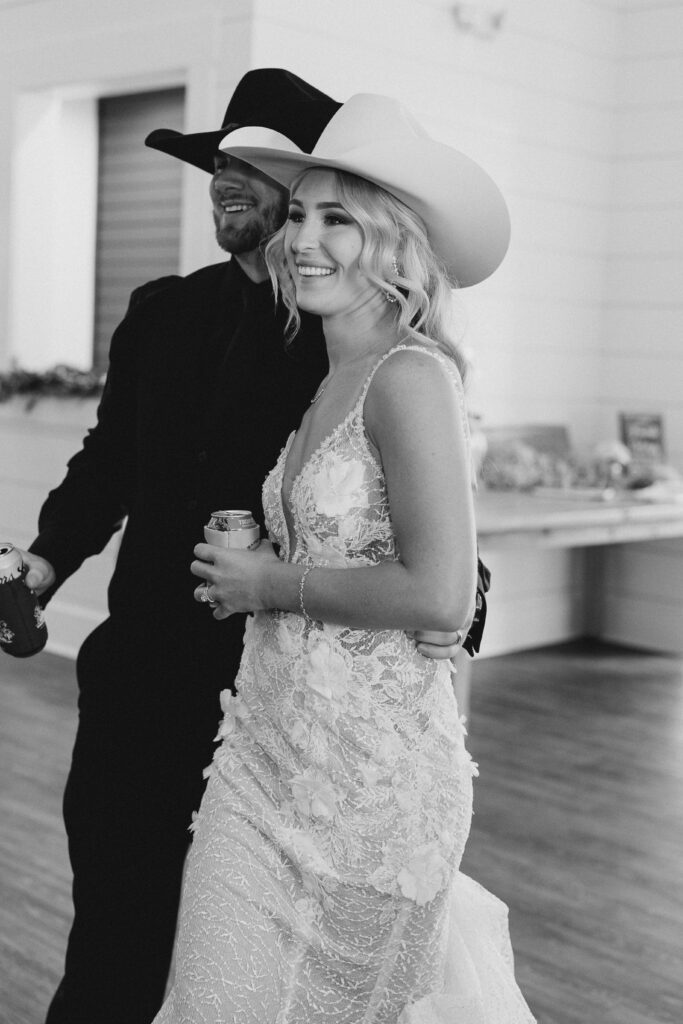 bride and groom in cowboy hats