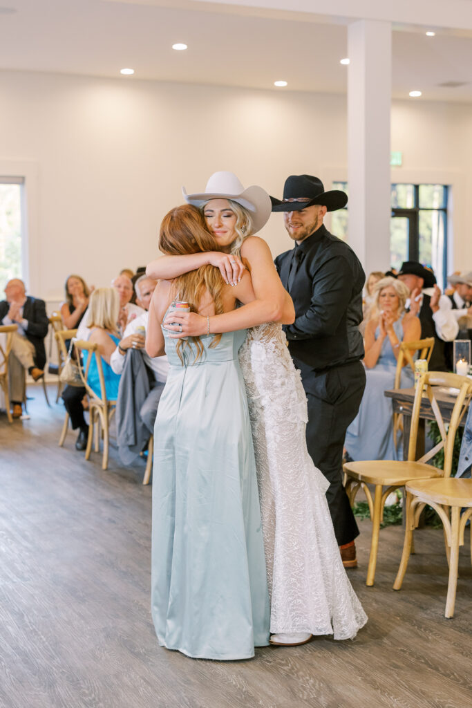 bride and her sister dancing