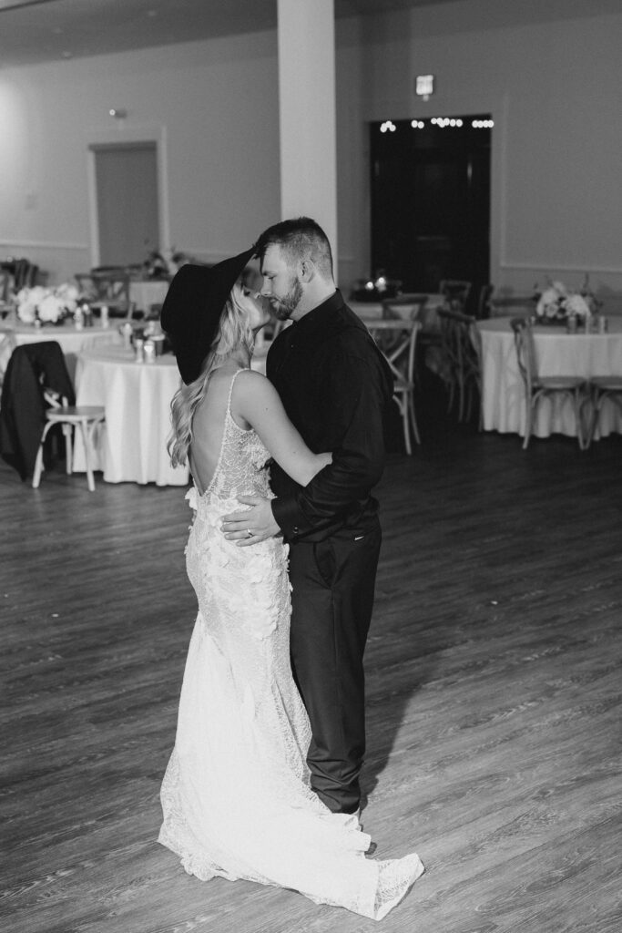bride and groom left dancing