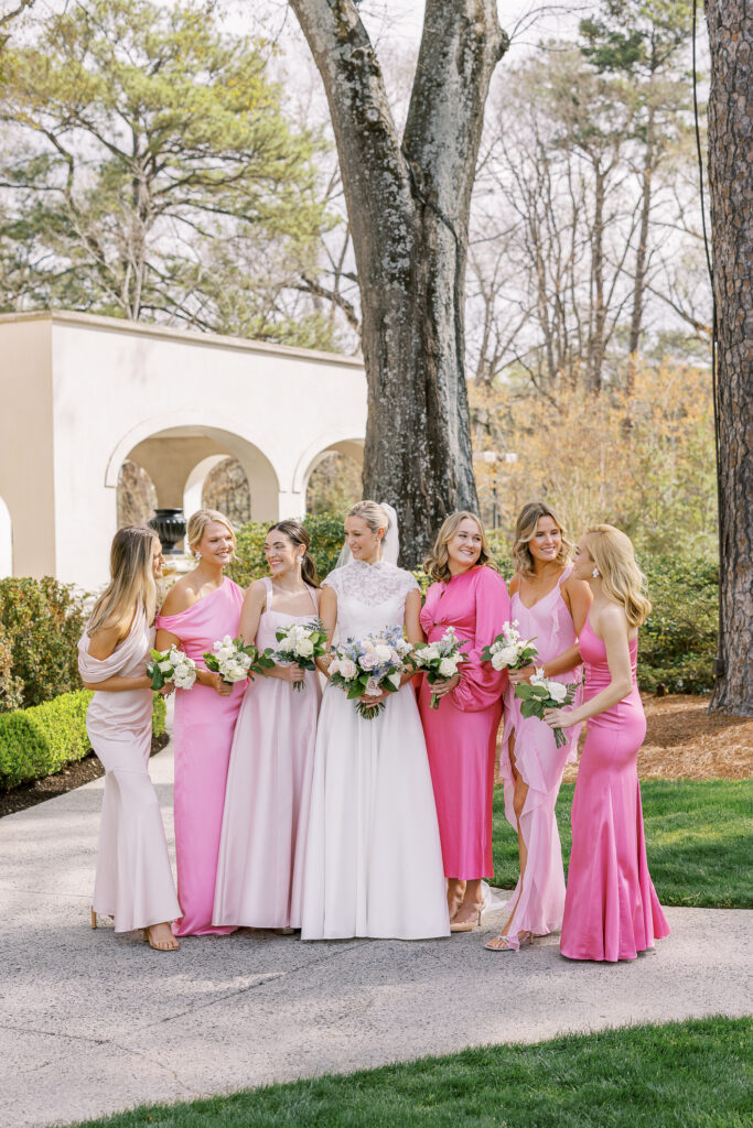 a bride and her bridesmaids all in pink