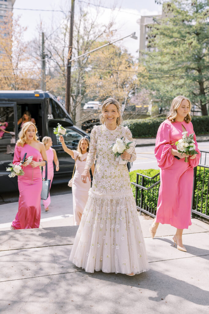 mother of the bride and bridesmaids getting out of a vehicle
