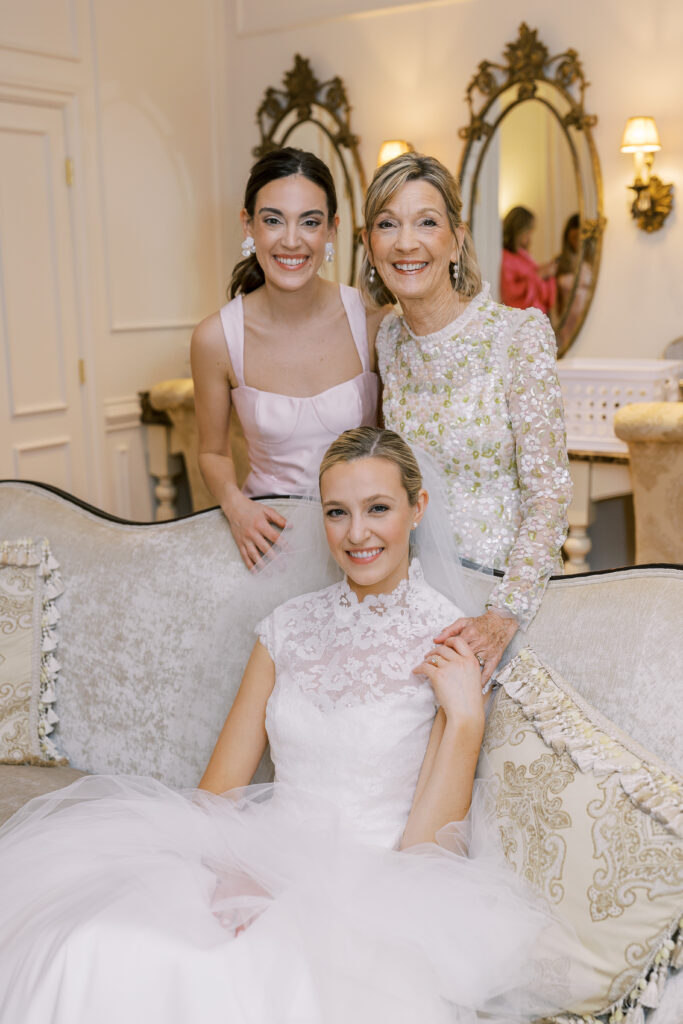 bride with her mom and sister moments before the wedding