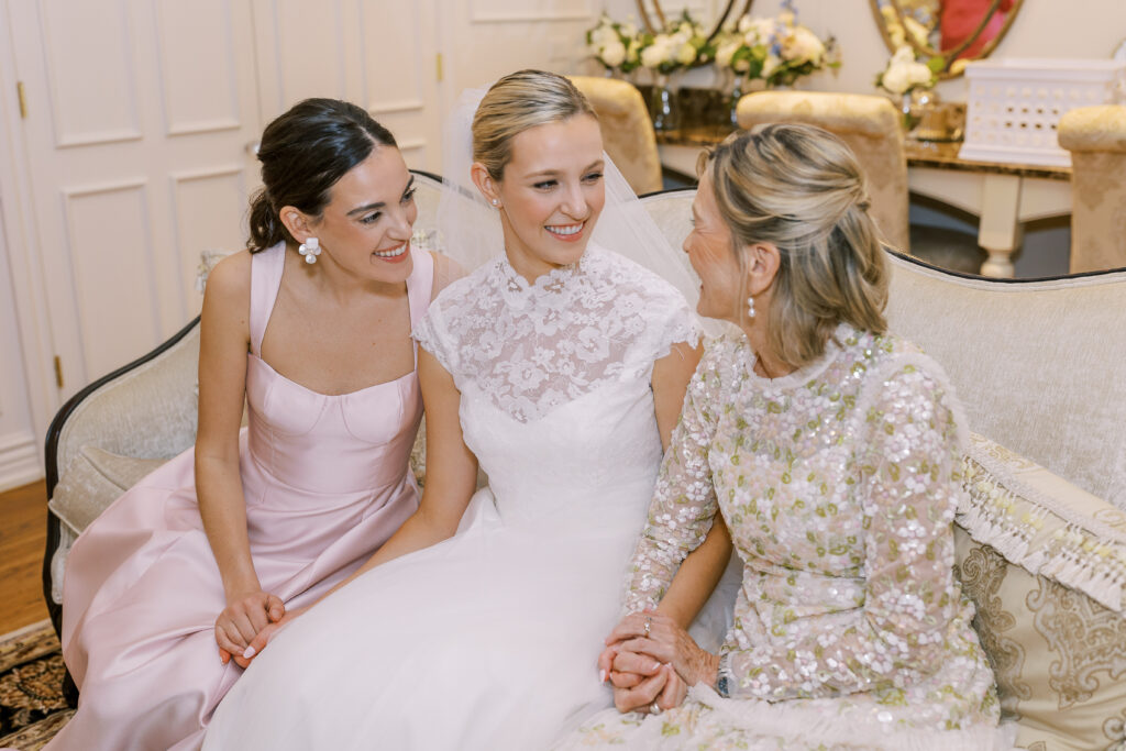bride with her mom and sister moments before the wedding