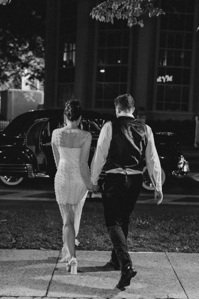 bride and groom leaving wedding reception