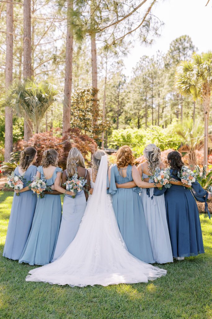 bride and her bridesmaids from behind