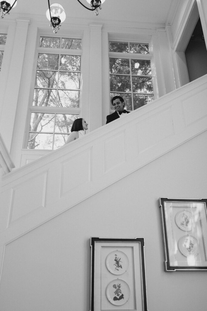 bride and groom going up the stairs