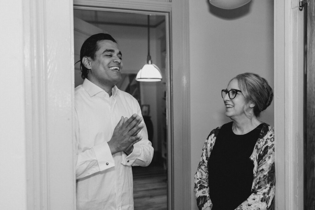 groom laughing with friend