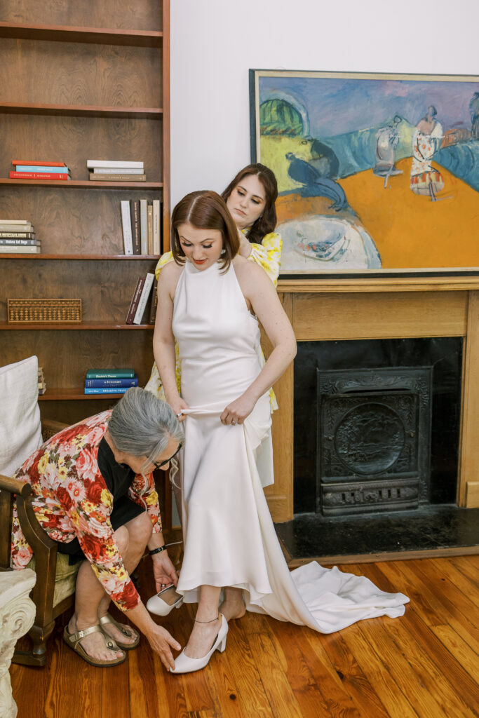 bride putting on her dress