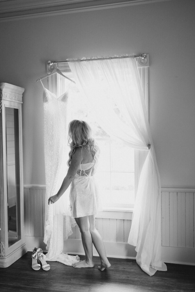 bride looking at her wedding dress