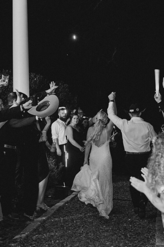 bride and groom leaving the reception