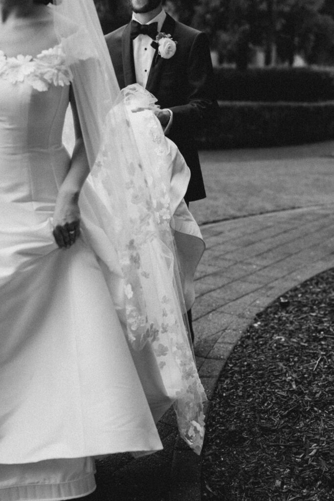 bride and groom walking into their wedding