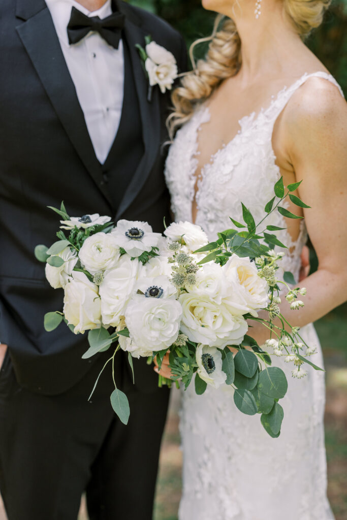 portrait of a bride and groom and her bouquet