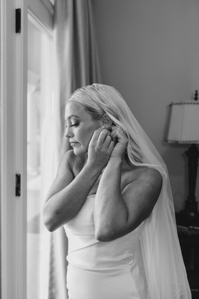 bride putting in her earring