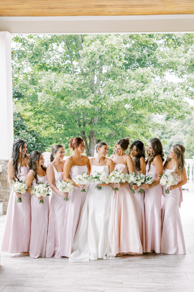 bride and her bridesmaids with bouquets