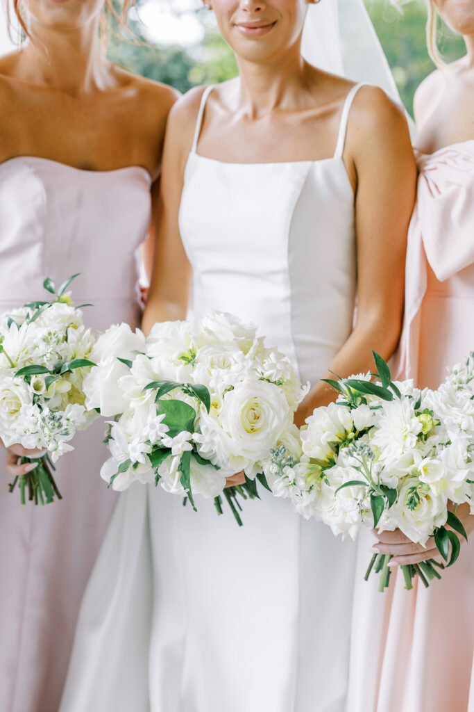 bride and her bridesmaids with bouquets