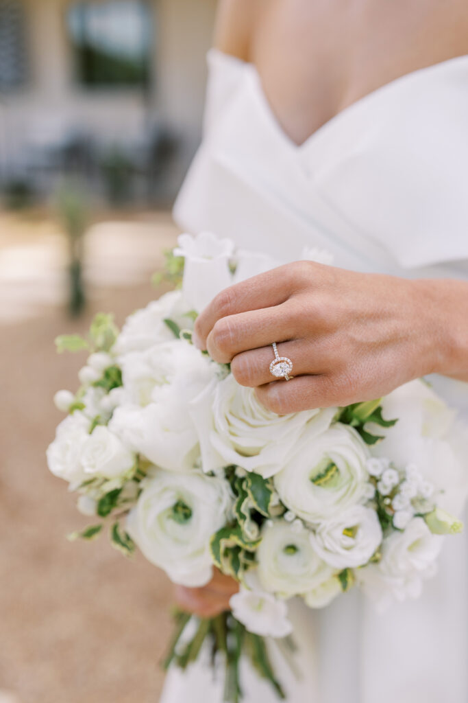 bride and her ring and bouquet