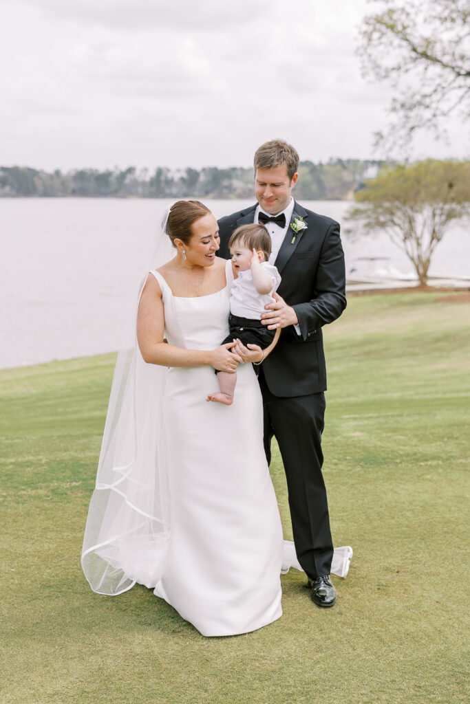 bride and groom first look with their son