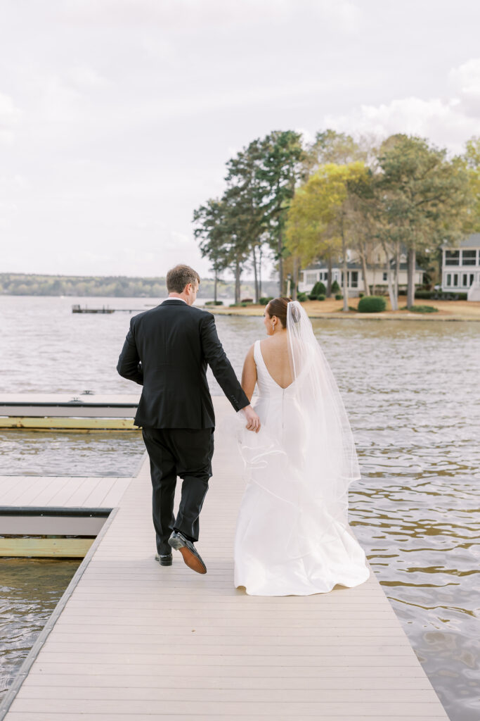 portrait of the bride and groom alongside the lake