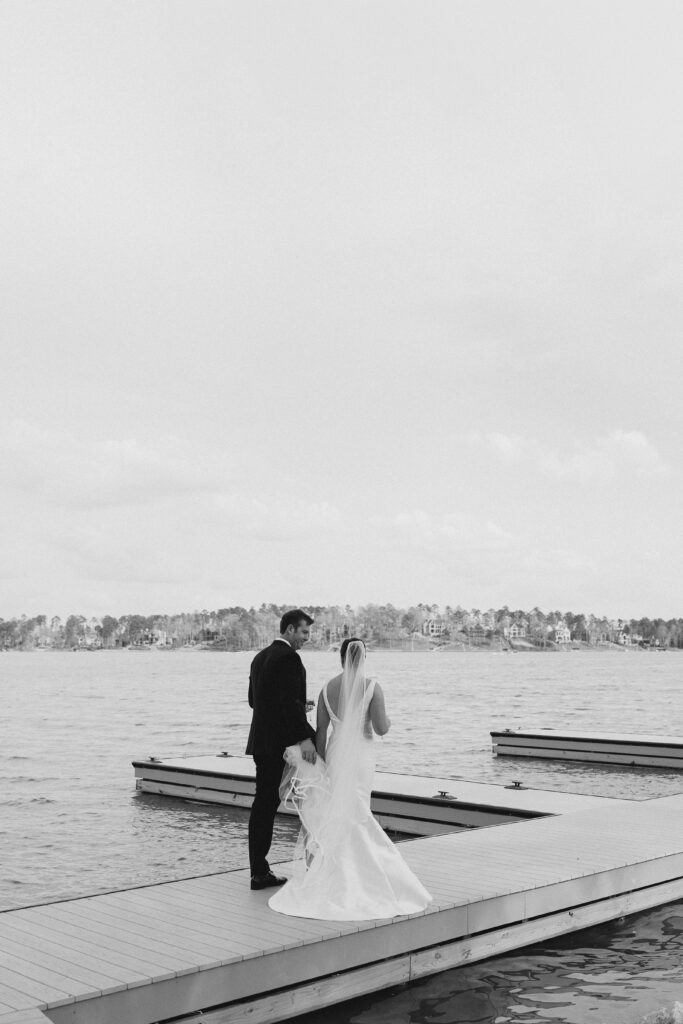 portrait of the bride and groom alongside the lake