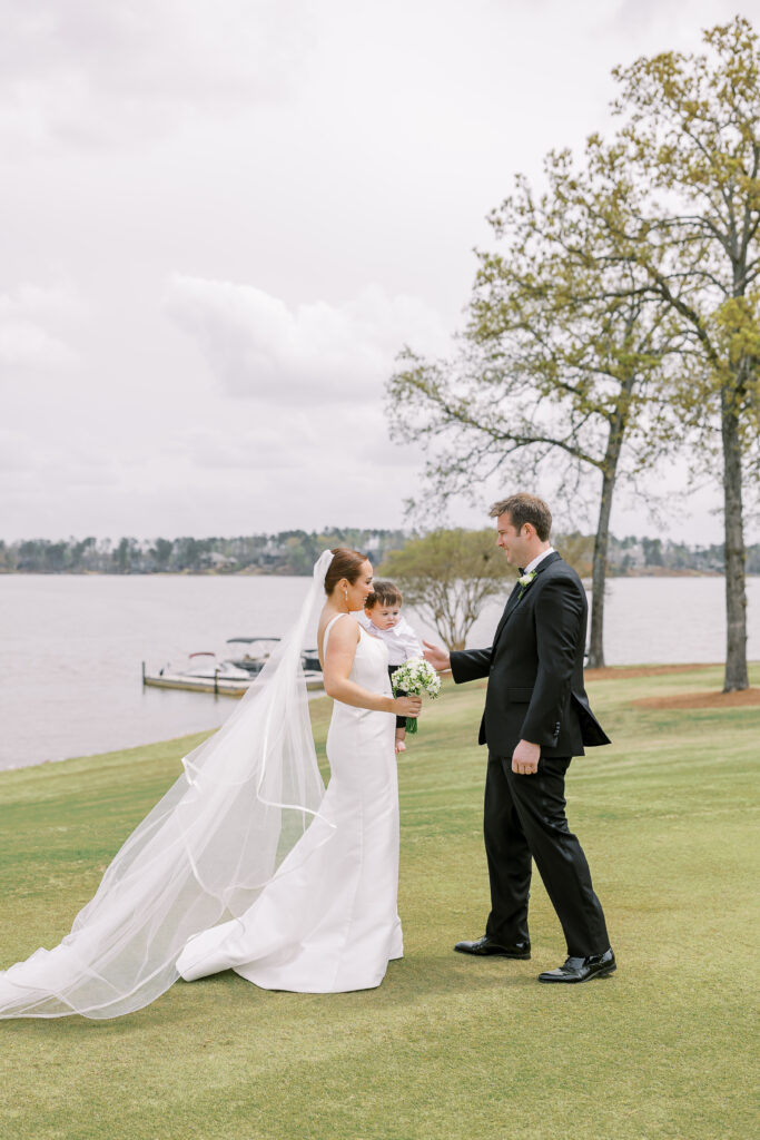 bride and groom first look with their son