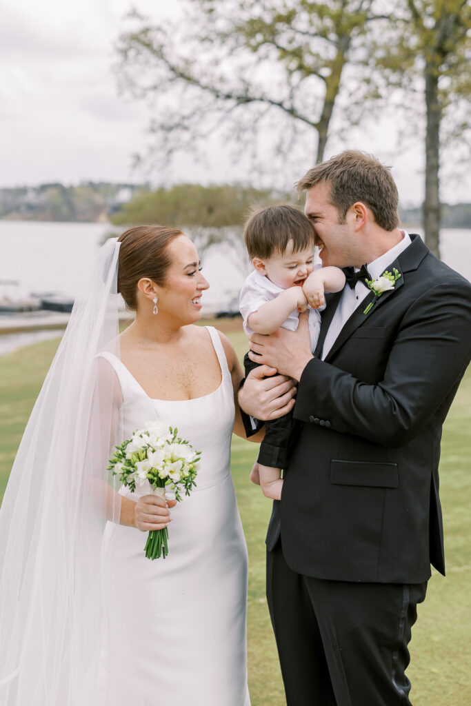 bride and groom first look with their son