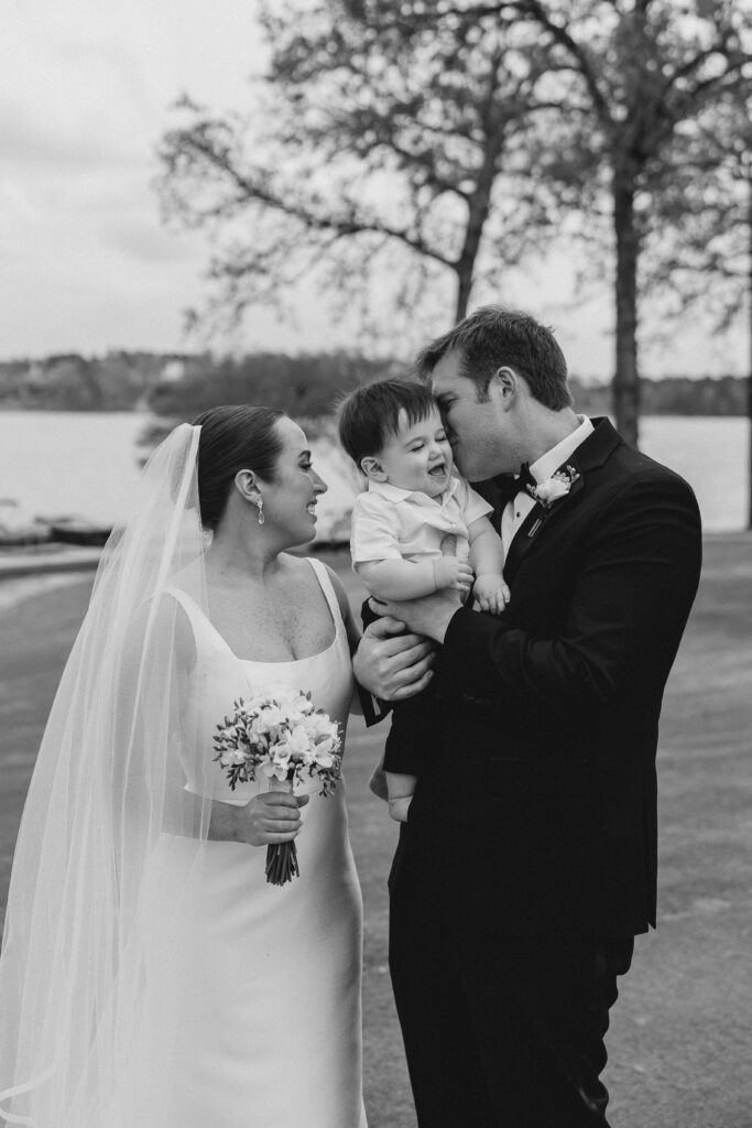 bride and groom first look with their son