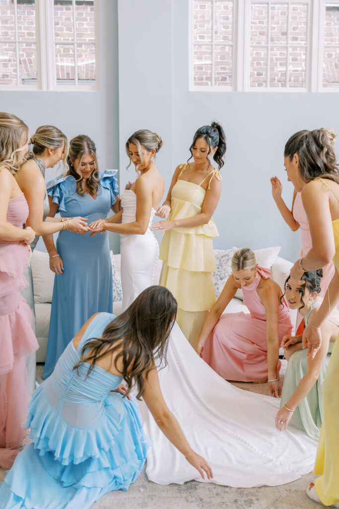 bride and her bridesmaids getting ready