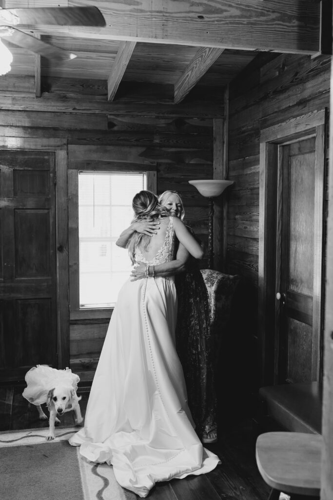 bride's mom helping her dress