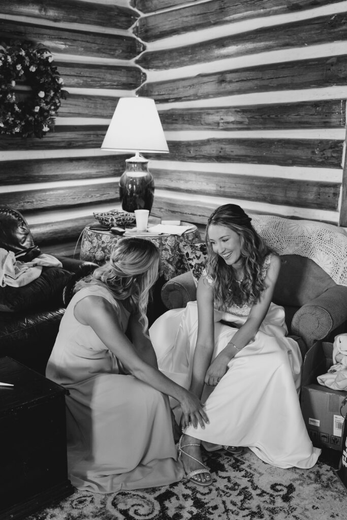 bride's mom helping her dress