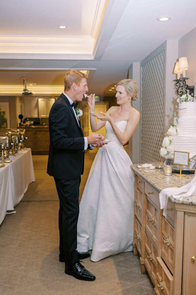 bride feeding groom cake