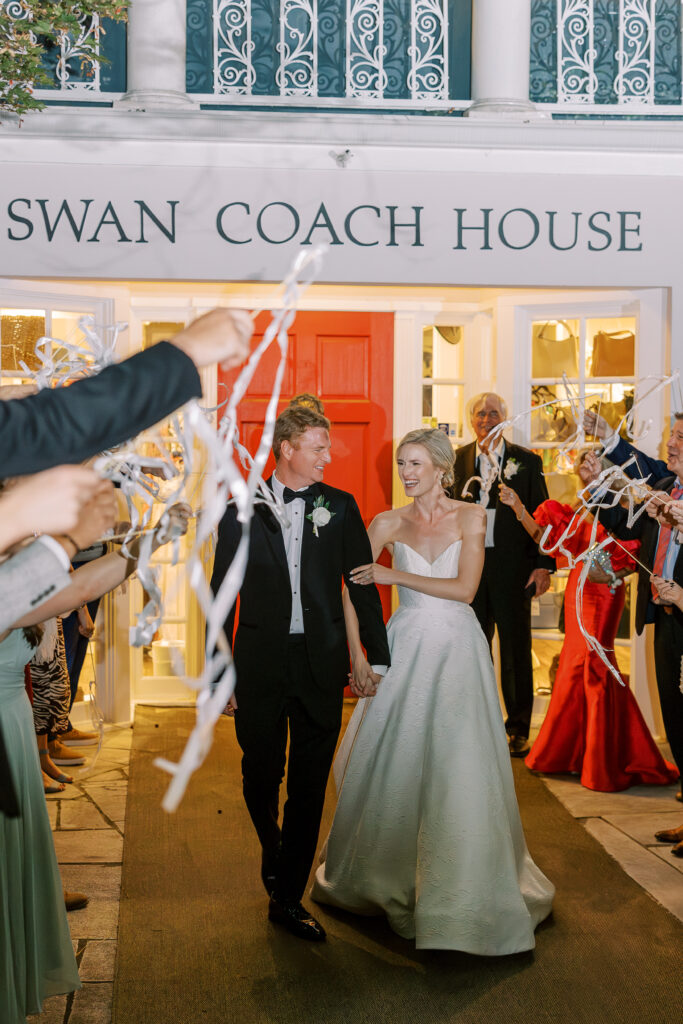 groom and bride leaving their wedding at The Swan Coach House