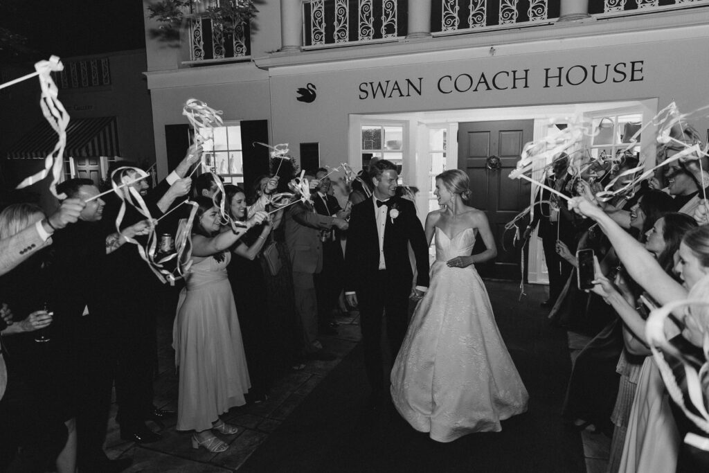 groom and bride leaving their wedding at The Swan Coach House