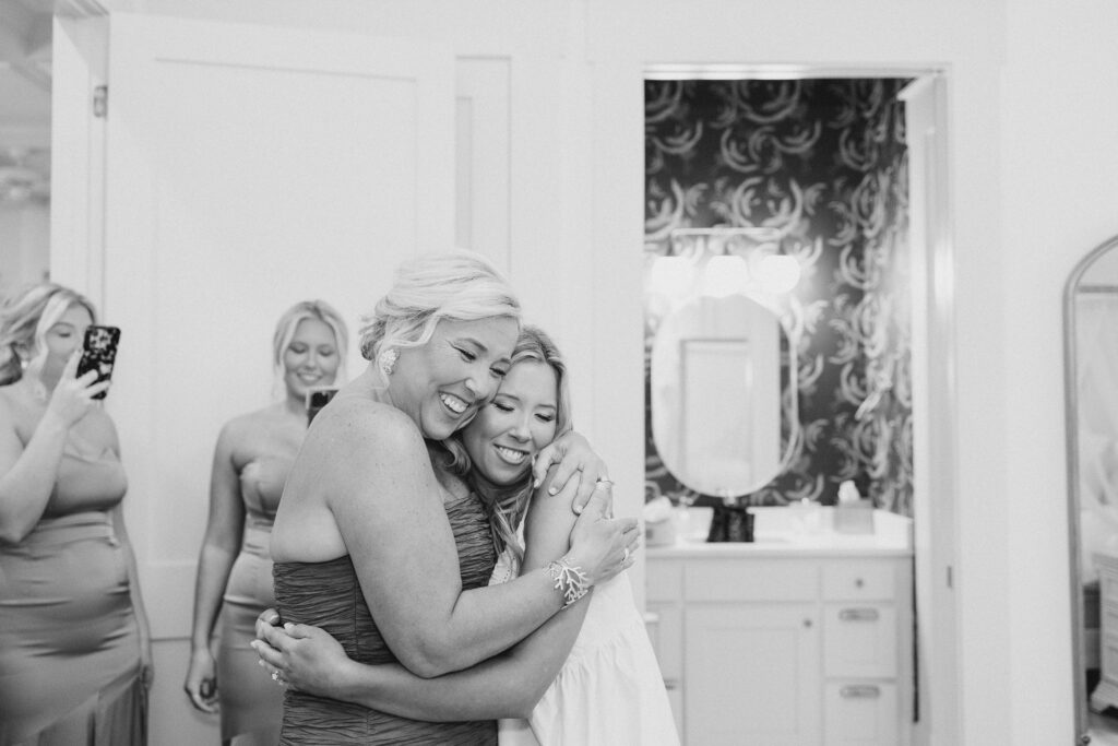 bride hugging her bridesmaid
