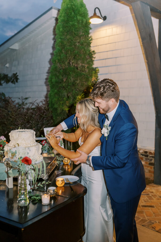 bride and groom cutting the cake
