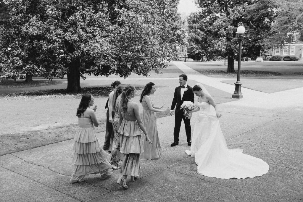 bridesmaids seeing bride and groom