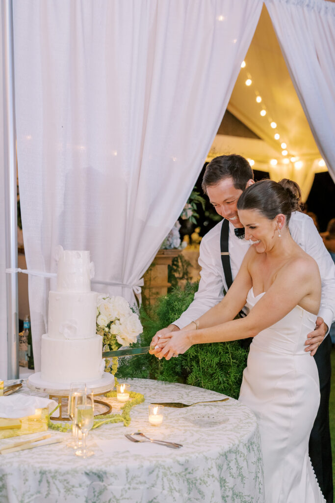 bride and groom cutting the cake