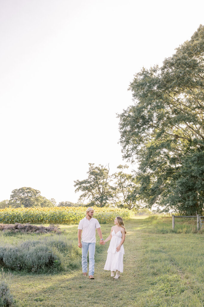 a couple's engagement session at wild daisy farm in molena, georgia
