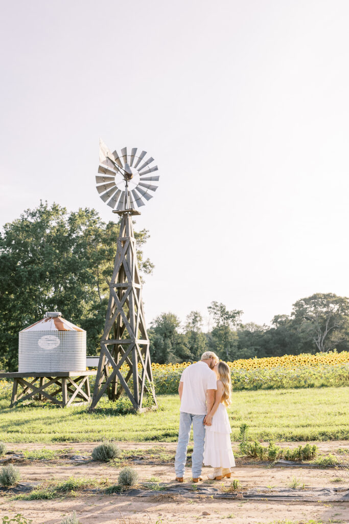 a couple's engagement session at wild daisy farm in molena, georgia