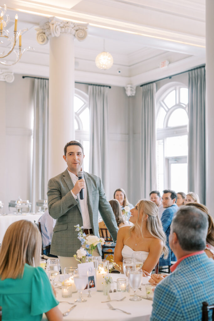 groom giving speech at rehearsal dinner