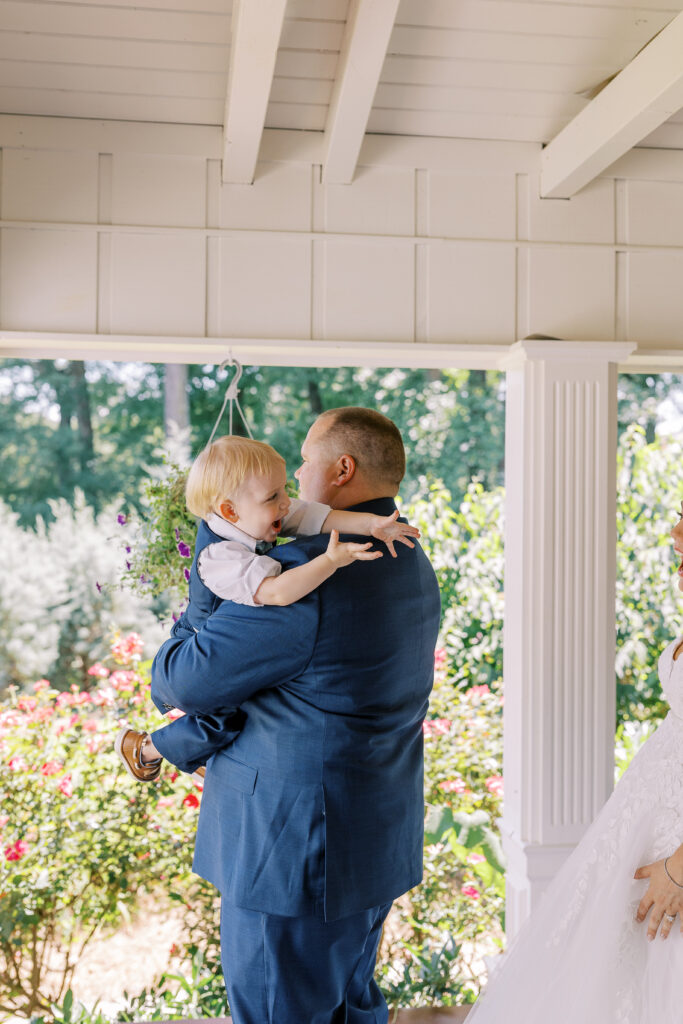 groom and son first look with bride