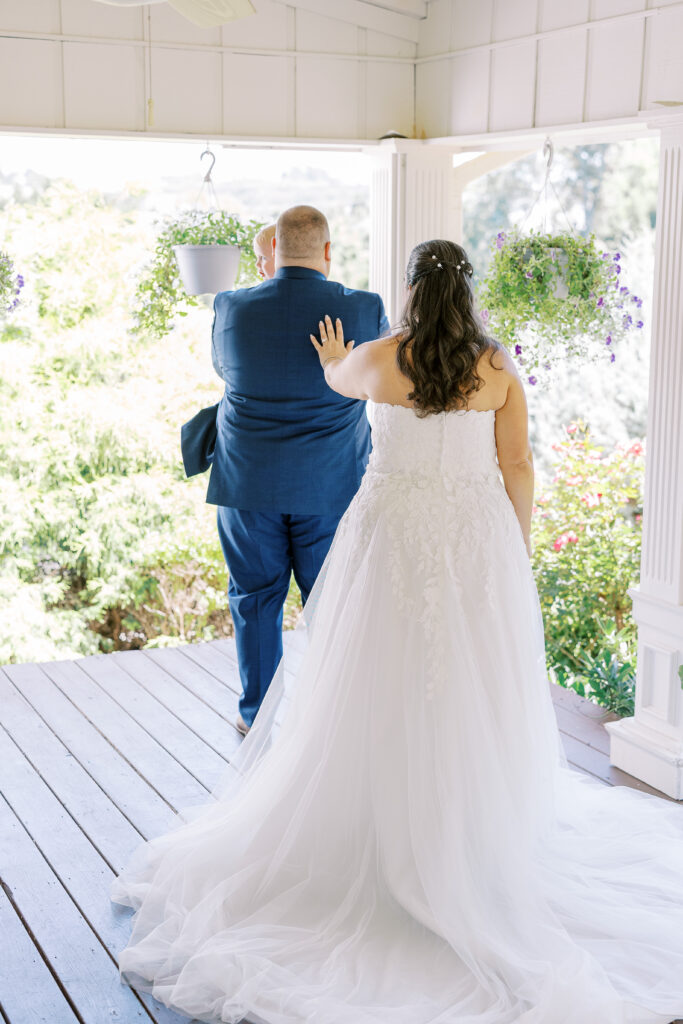 groom and son first look with bride