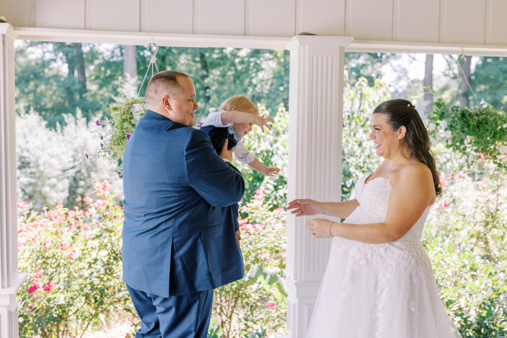 groom and son first look with bride