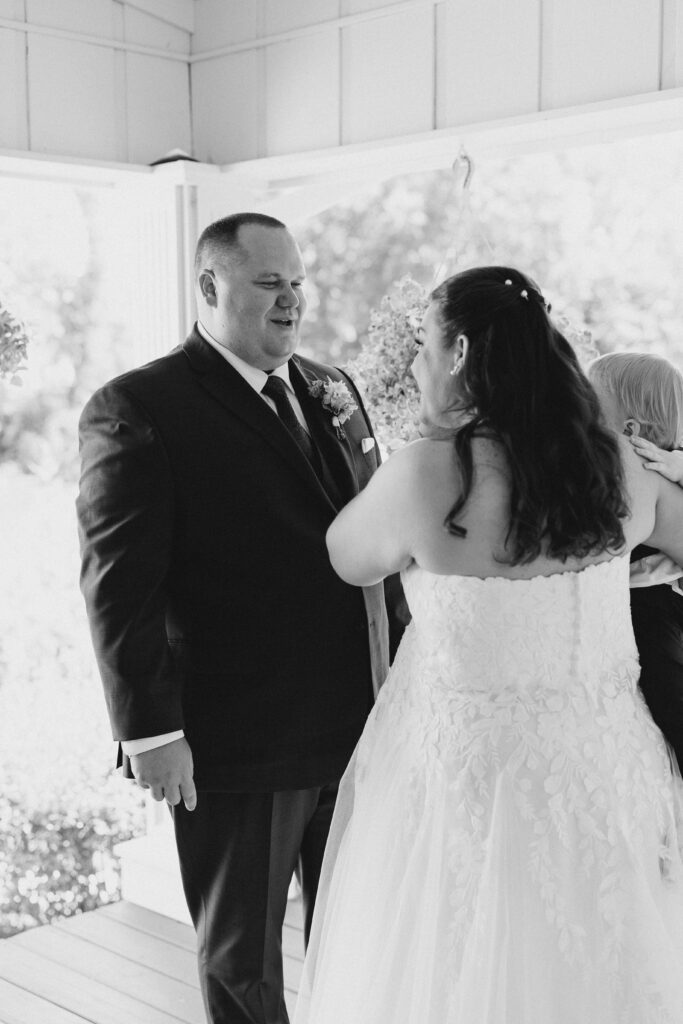 groom and son first look with bride
