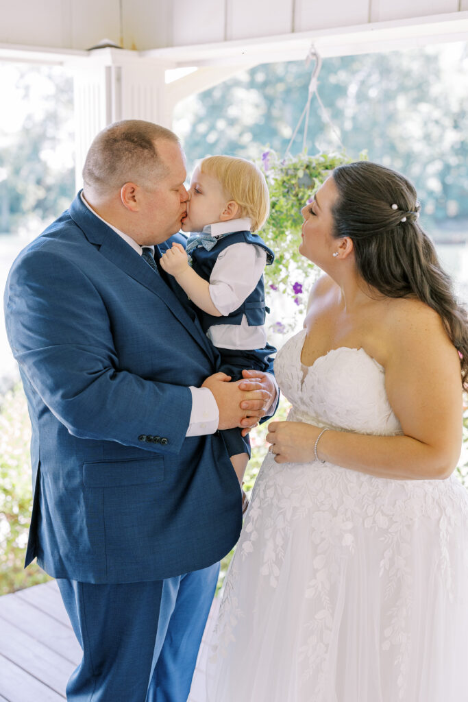 groom and son first look with bride
