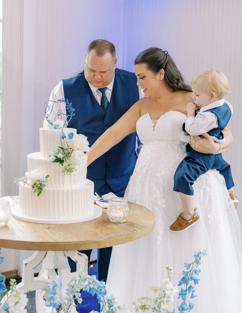 bride and groom cutting the cake