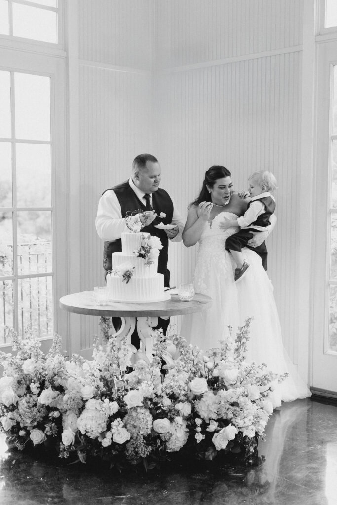 bride and groom and son eating cake